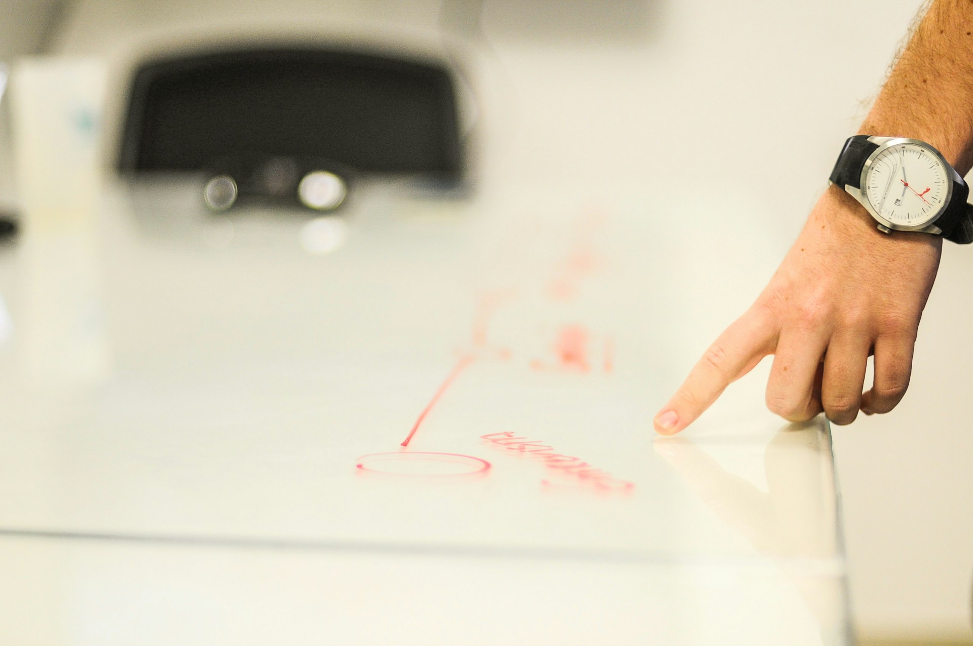 construction manager pointing to a document