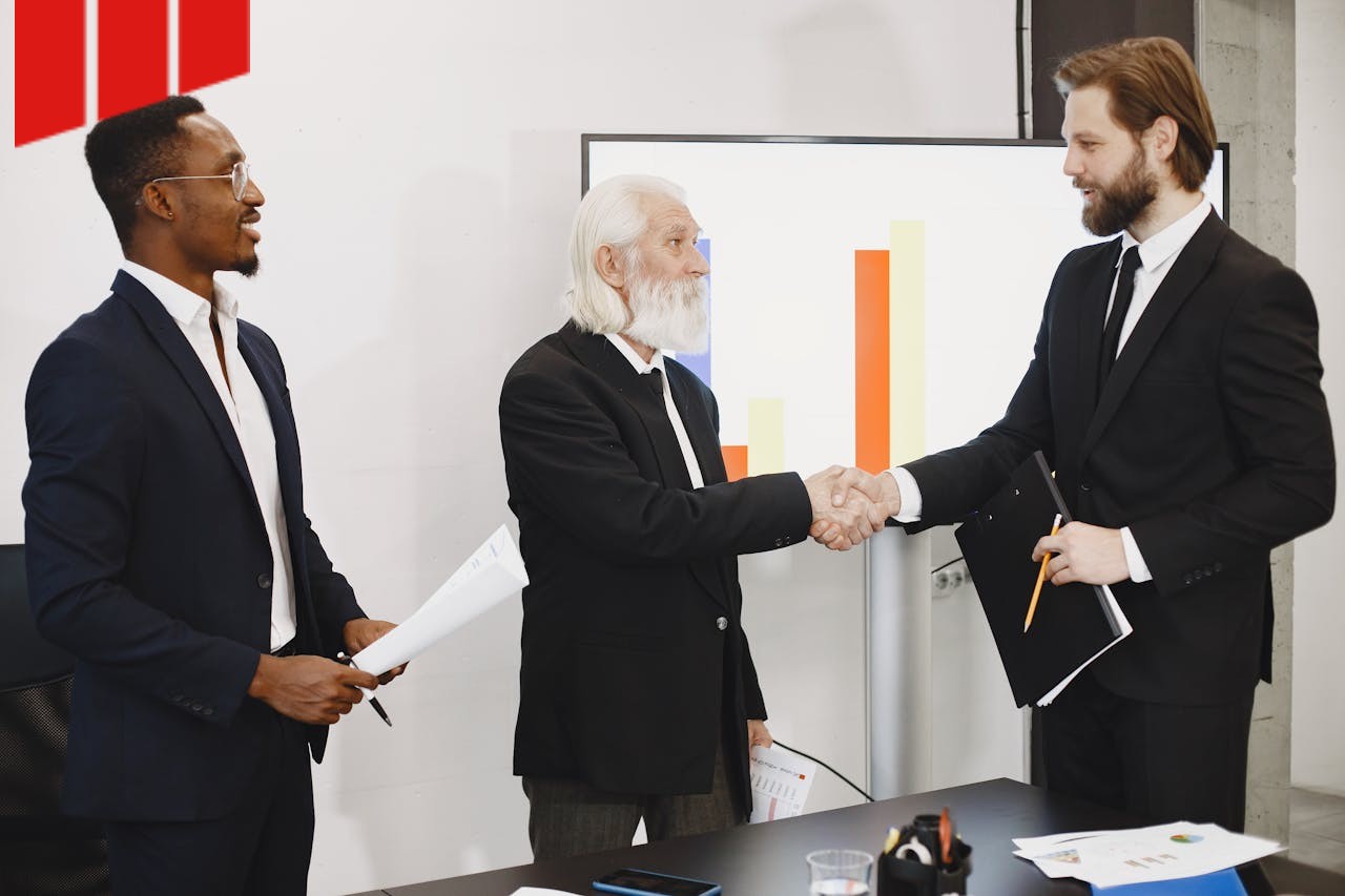 shaking hands after a successful tender evaluation meeting