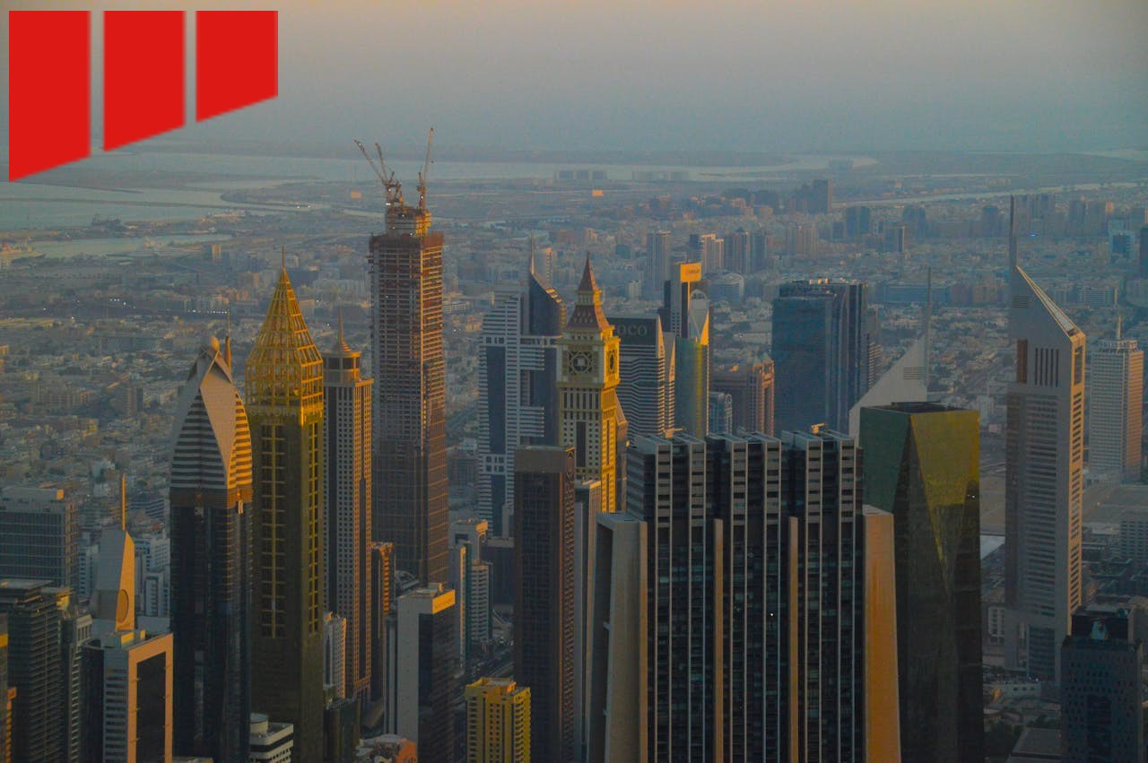 a skyline of tall buildings, some under construction