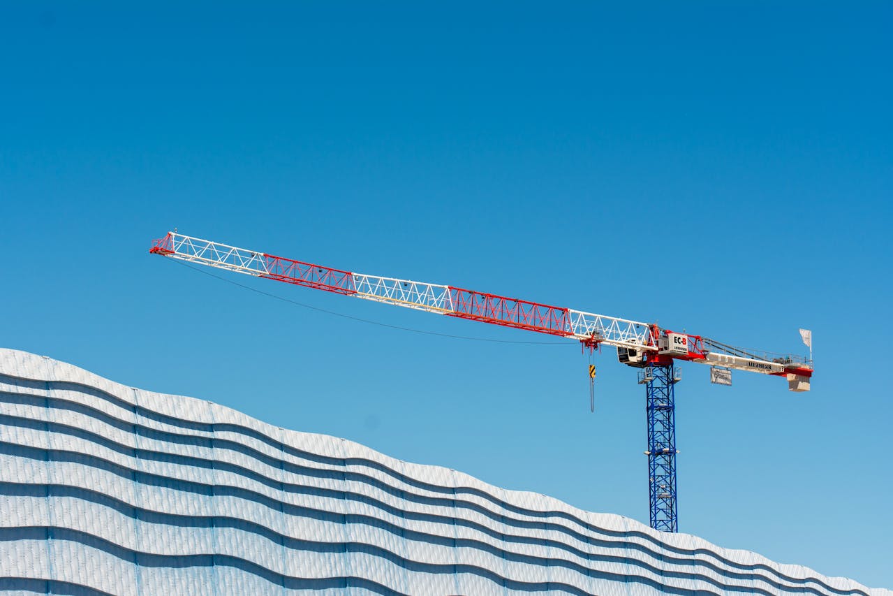 A tower crane above a construction site